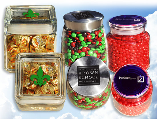 Many Glass Jars With Caps Filled With Cookies And Sweets On